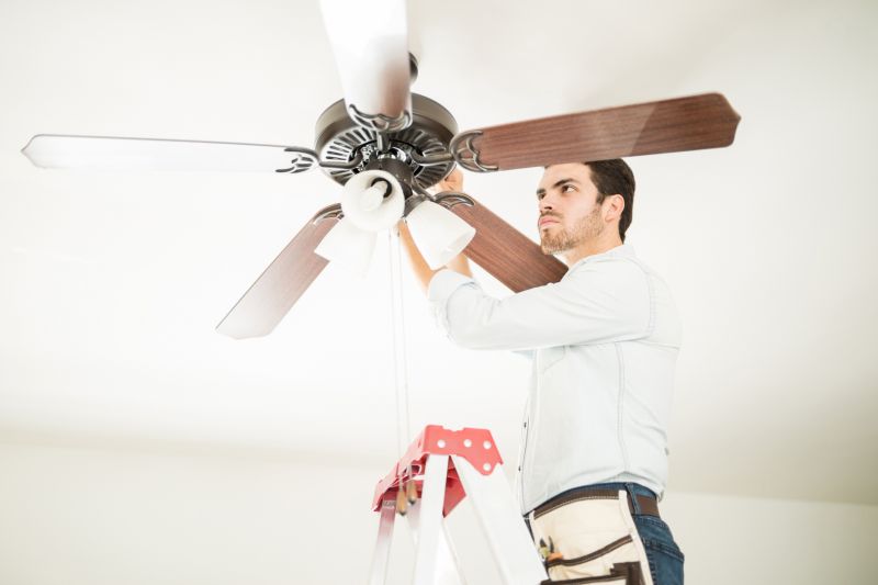 Handyman installing a ceiling fan
